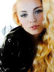 Youthful blond hotty Mila T strikes great bare positions in lengthy boots