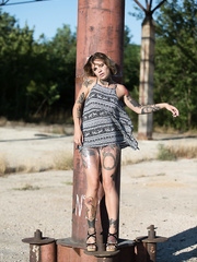 Tattooed babe Stacy Cloud works her way free of plastic wrap outdoors