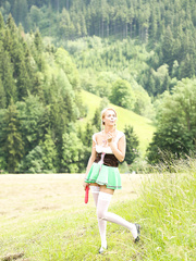 Youthful and breasty golden-haired hotty masturbates in freshly cut hay field