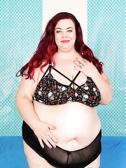 Redhead SSBBW Miss Ladycakes lifts up her chunky rolls to finger her excited bawdy cleft