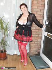 Chunky dilettante with short hair Perverteds Carol exposes her giant wobblers in red stockings