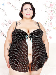 Fat dark brown Mia Riley unharnessing floppy melons in advance of toying her bawdy cleft