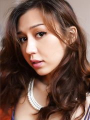 Marvelous Oriental hotty in purple nylons showing her hot shaved beaver close up