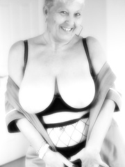 Old woman with short hair and floppy milk sacks dons a  in fishnet hose