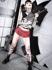 Tattoo enthusiast Malice Mcmunn disrobes to Doc's whilst handling guns