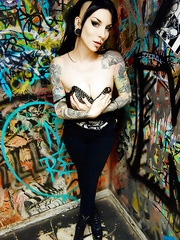 Goth cutie Razor Candi disrobes to OTK boots in graffiti filled bath