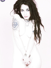 Goth hotty Hope strikes tempting positions in knee high boots and OTK stockings