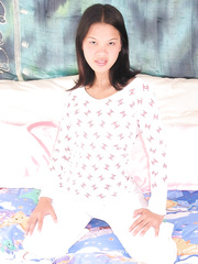 Fuckable oriental chick masturbating her pleasant curly wet crack with a large sex tool