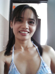 Ravishing oriental honey exposing her admirable bumpers and fingering her curly snatch