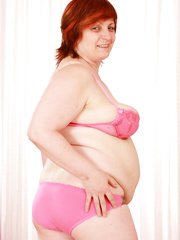 Redhead granny peels showing saggy large natural melons & acquires cum-hole pounded