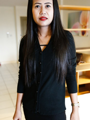 Slender Thai female removes her little darksome costume for her 1st stripped positions