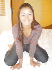 Seductive oriental hottie stripping off her raiment and widening her legs