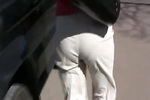 Russian white lady Olga in the park urinates in her white panties