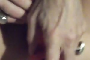 Mature whore with a bushy fur pie is fucking herself with her favourite sex tool