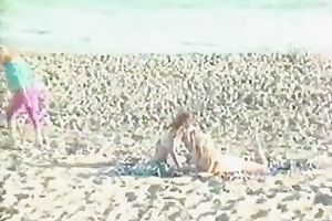 Outdoor retro episode with honeys eating twats on a beach