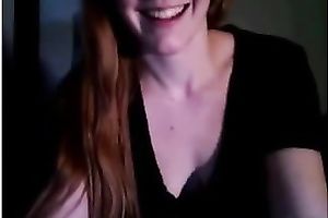 Redhead legal age teenager smashes her snatch with a marital-device on livecam