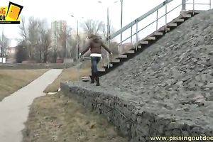 Nasty brunette hair gal likes to pee in the street during a walk