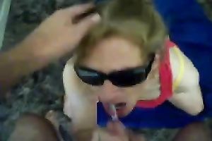 Filthy floozy in sunglasses knows how to give a admirable footjob