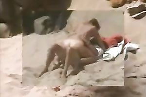Redhead milf sucks her man's 10-Pounder and takes a ride on it on a beach