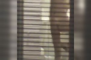 Magnificent wife living next building walks undressed in her apartment