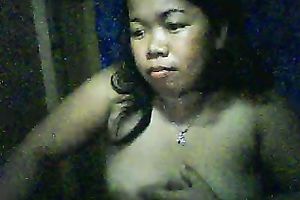 Chubby Filipina doxy shows her scones and fingers her shaved pussy