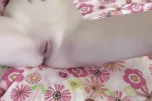 Slim blonde floozy with wonderful mambos pleases herself with a green marital-device