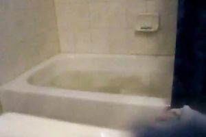 Attractive babe is taking a bubble bathroom in a hot way