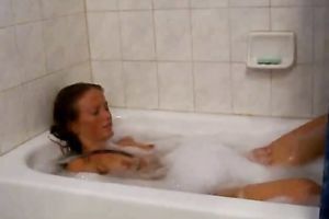 Attractive babe is taking a bubble bathroom in a hot way