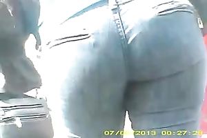 Spy web camera vid with a big-assed gal wearing jeans walking down the street