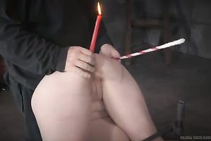 Hogtied blondie with burning candle in her wazoo is spanked