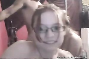 Two slender teenage gals engulf guy's hard dick in turn