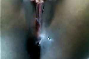 Black chick is rubbing her bald snatch like there's no the next day