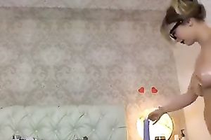 Busty BBC slut in glasses shows her oiled body and fingers her slit