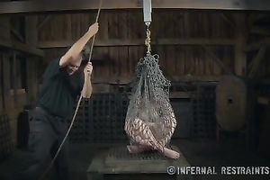 Slender blondie with pale skin bounded with net restrained by her mentor