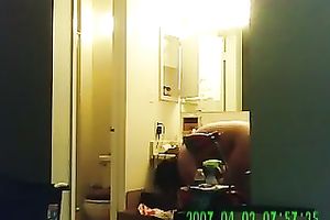 Chunky brunette hair hotwife putting lotion all over her body after shower