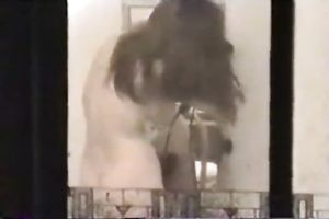 A spy clip showing a horny white wife drying her hair totally nude