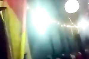 Amateur brunette hair hussy dances in front of a crowd in homemade video