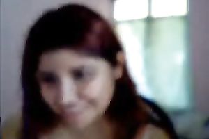 Red-haired virtual hooker shows off her large boobs and booty