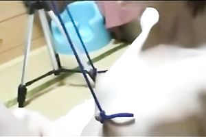 Her sharp merry nipps are bound up with ropes and pulled