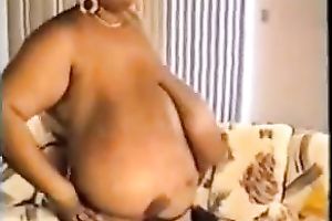 Horny ebon whore proudly flaunts her disproportionately big boobies