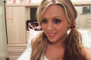 Cute pigtailed horny white wife fingers her pussy in front of a cam