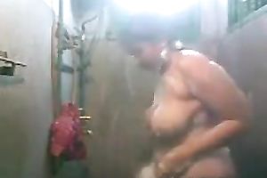 Voluptuous Indian charmer rubs the soap over her large boobies