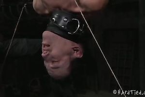 Nasty dark brown thrall suspended upside down and tortured