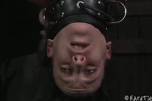 Nasty dark brown thrall suspended upside down and tortured