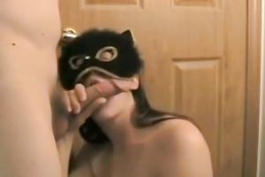 Brunette white housewife in the mask gives head to her spouse