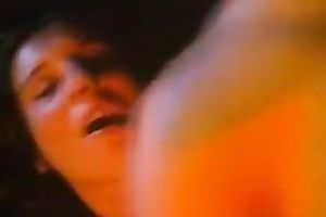 Retro dark brown groans sweetly whilst getting her cookie screwed