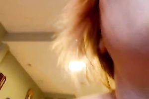 Busty web camera redhead hottie groans sweetly during the time that riding a sex-toy