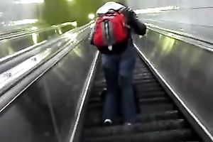 This hot babe receives on an escalator and has no idea I am spying on her