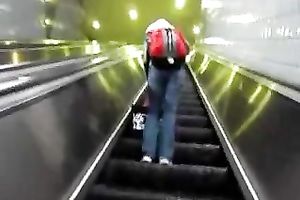 This hot babe receives on an escalator and has no idea I am spying on her