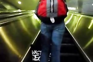 This hot babe receives on an escalator and has no idea I am spying on her